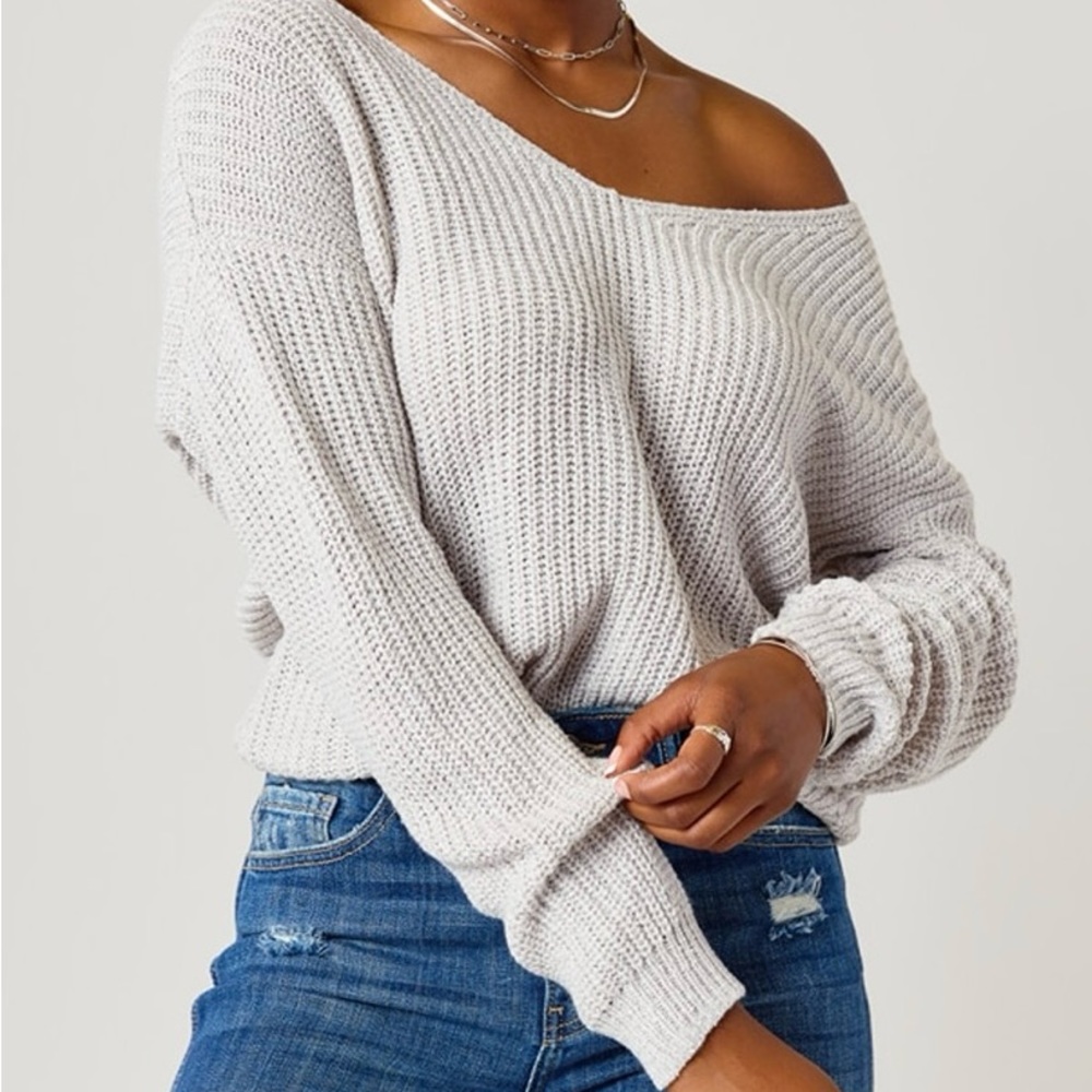 Grey knit sweater with back knot